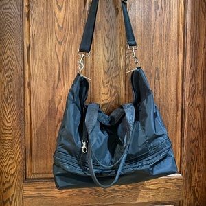 Gym bag black multiple pockets. Shoe storage on bottom of bag